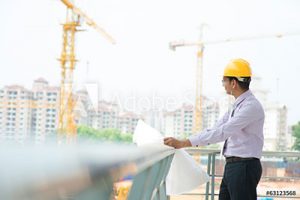 civil engineers insurance - man on site reviewing plans