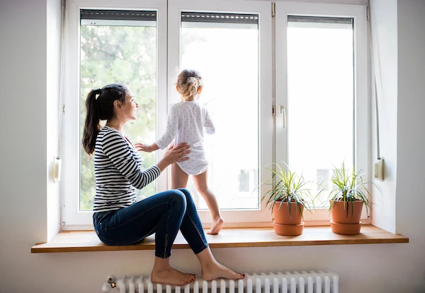 light shining through window mother and child