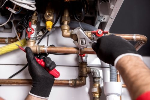 Plumber Fixing Central Heating