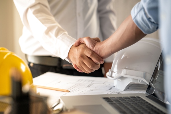 Employer and contractor hand shake