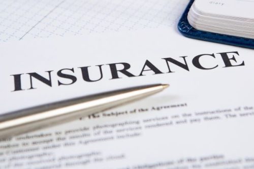 pen on insurance contract Insurance Contract Concept Closeup