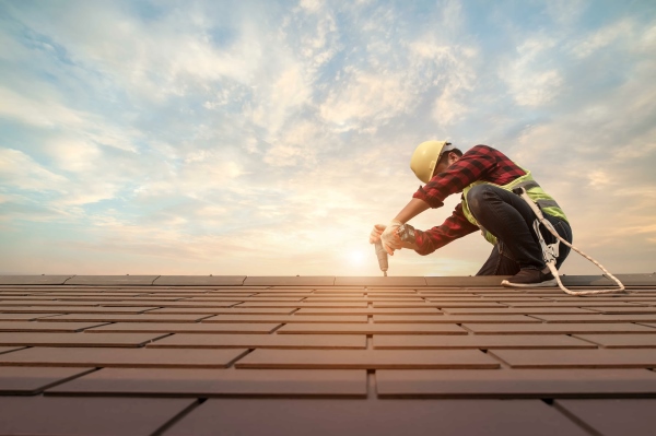 Roofer working in protective work wear