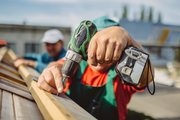 roofer using a drill