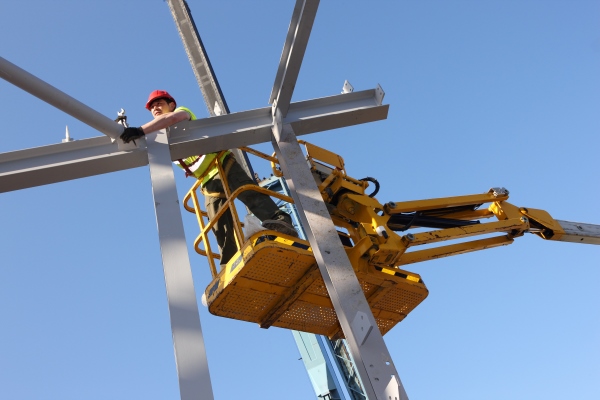 Steel Worker on Cherry Picker