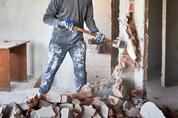 Sledgehammer Removing Brick Wall