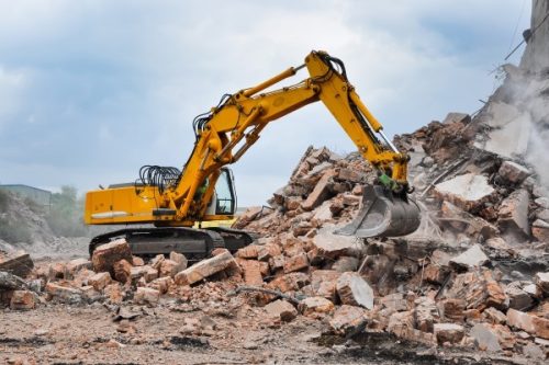 Excavator working at the demolition of an old building Excavation Work